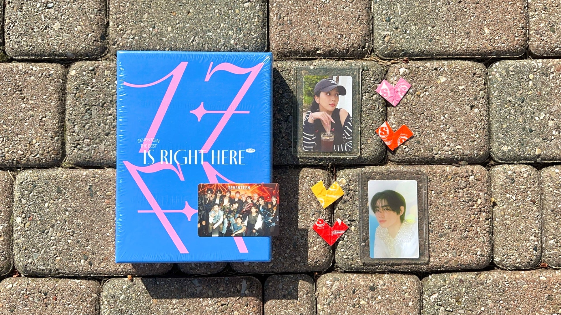 Demo box laid out with Seventeen album and Jisoo and Sunghoon photocards.